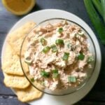 Overhead shoot of a bowl with tuna dip and crackers on the side