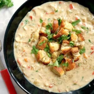 A black bowl with cream of chicken soup