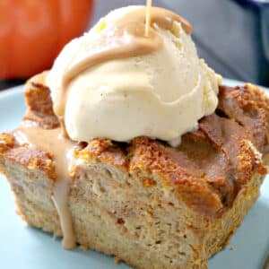 A slice of pumpkin bread pudding topped with ice cream