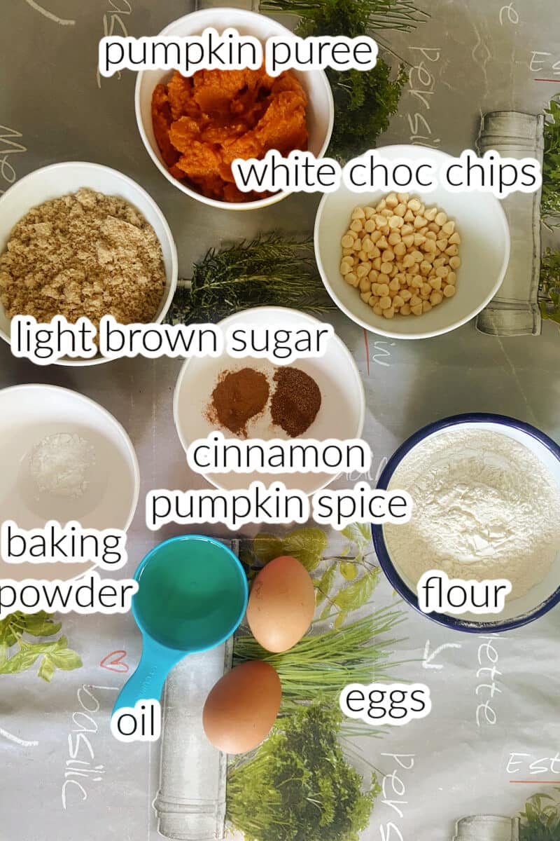 Ingredients needed to make pumpkin muffins with white chocolate chips.