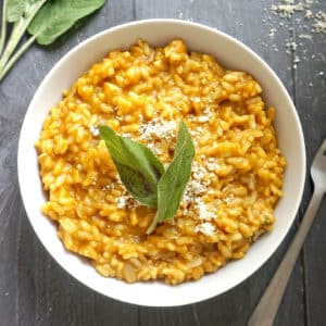 Overhead shoot of a white bowl with pumpkin risotto