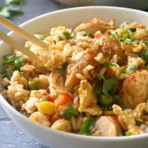 A bowl with chicken egg fried rice