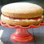 A Sandwich Cake on a red cake stand