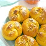 Savoury Pumpkin Dinner Rolls made with canned pumpkin; soft and fluffy, and so easy to make. From little to big tummies, your whole family will be in love with these little pumpkin beauties. Call them pumpkin buns or pumpkin knots, they are absolutely amazing. A great holiday side for your Thanksgiving or Christmas dinner. #homemadedinnerrolls #dinnerrolls #pumpkinrolls #pumpkinrecipe #thanksgivingside , #pumpkin