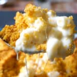 A spoonful of mac and cheese with bread crumbs