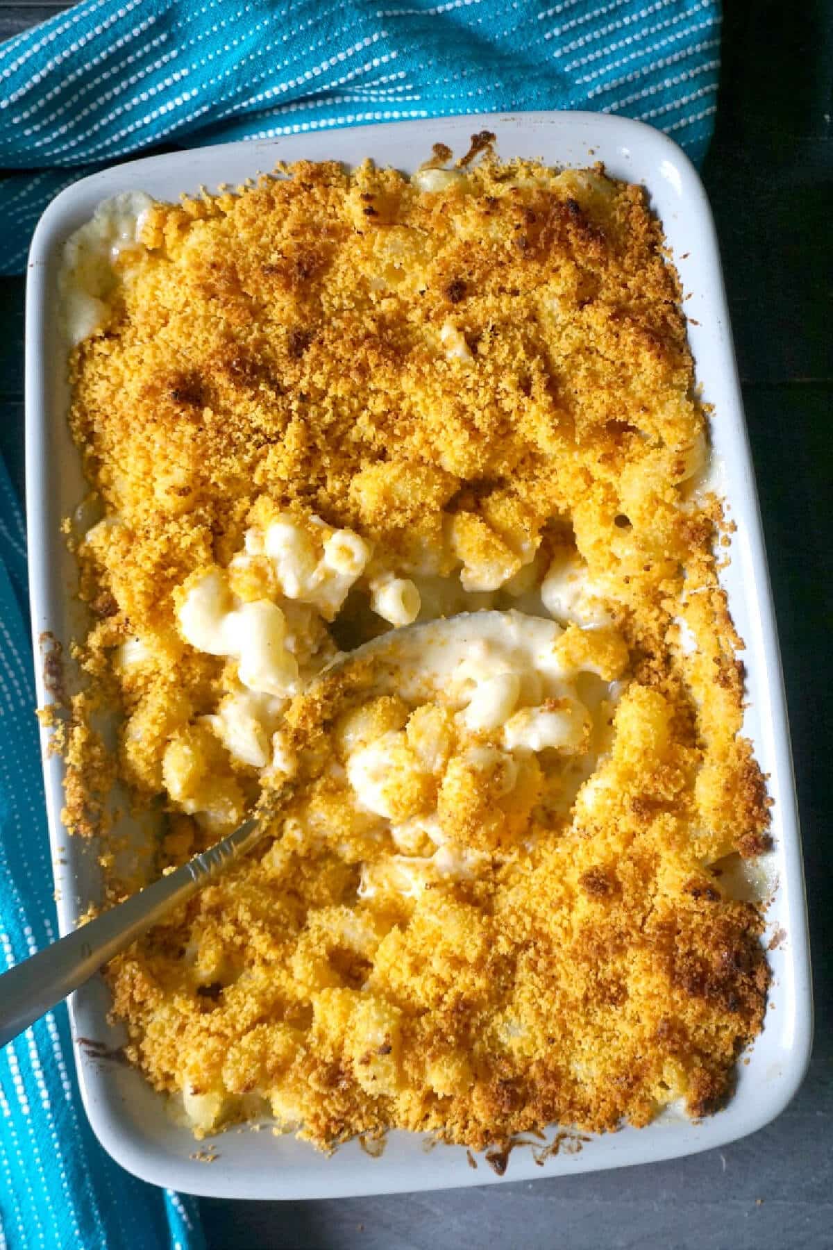 A dish with mac and cheese topped with bread crumbs.