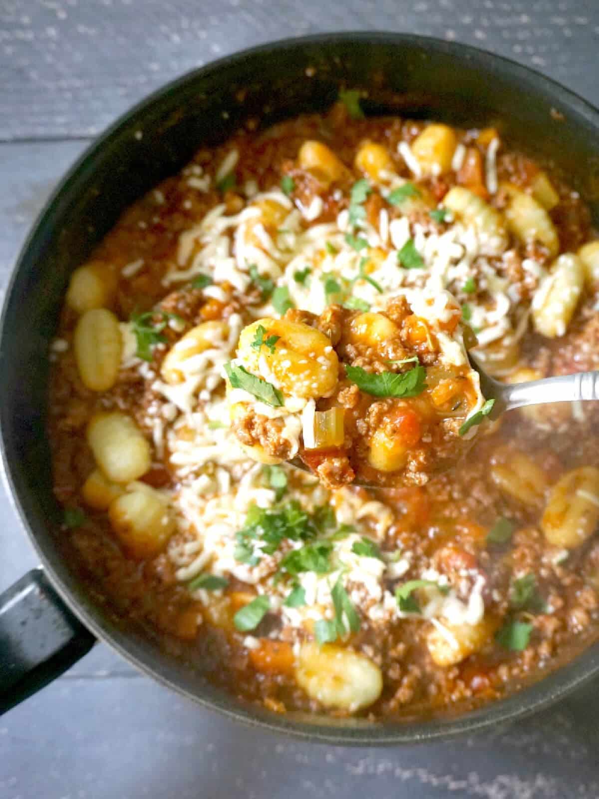 A pan with gnocchi bolognese.
