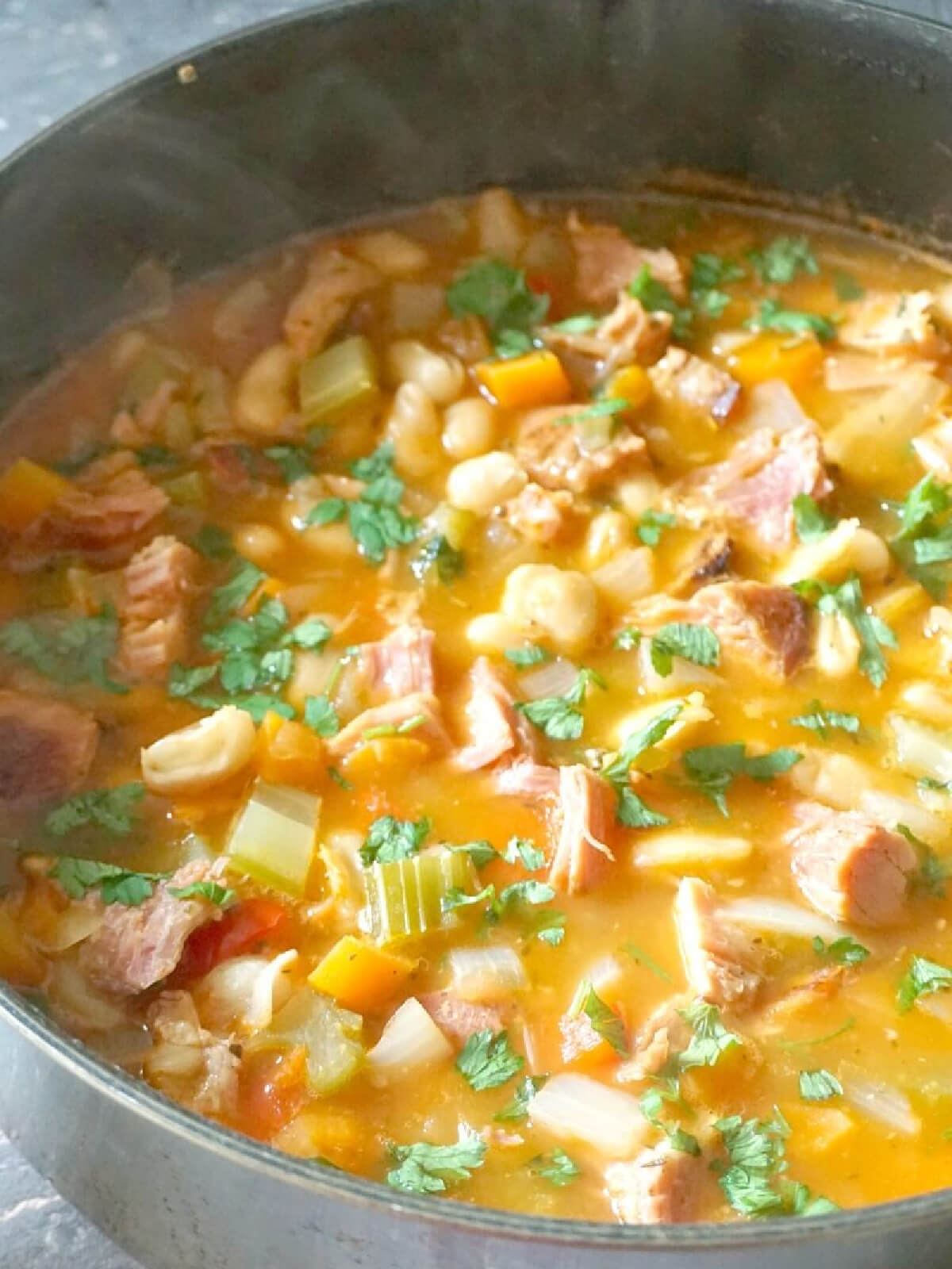 A pot with ham and bean soup.