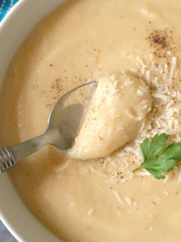 Close-up shoot of a white bowl with roast parsnip soup