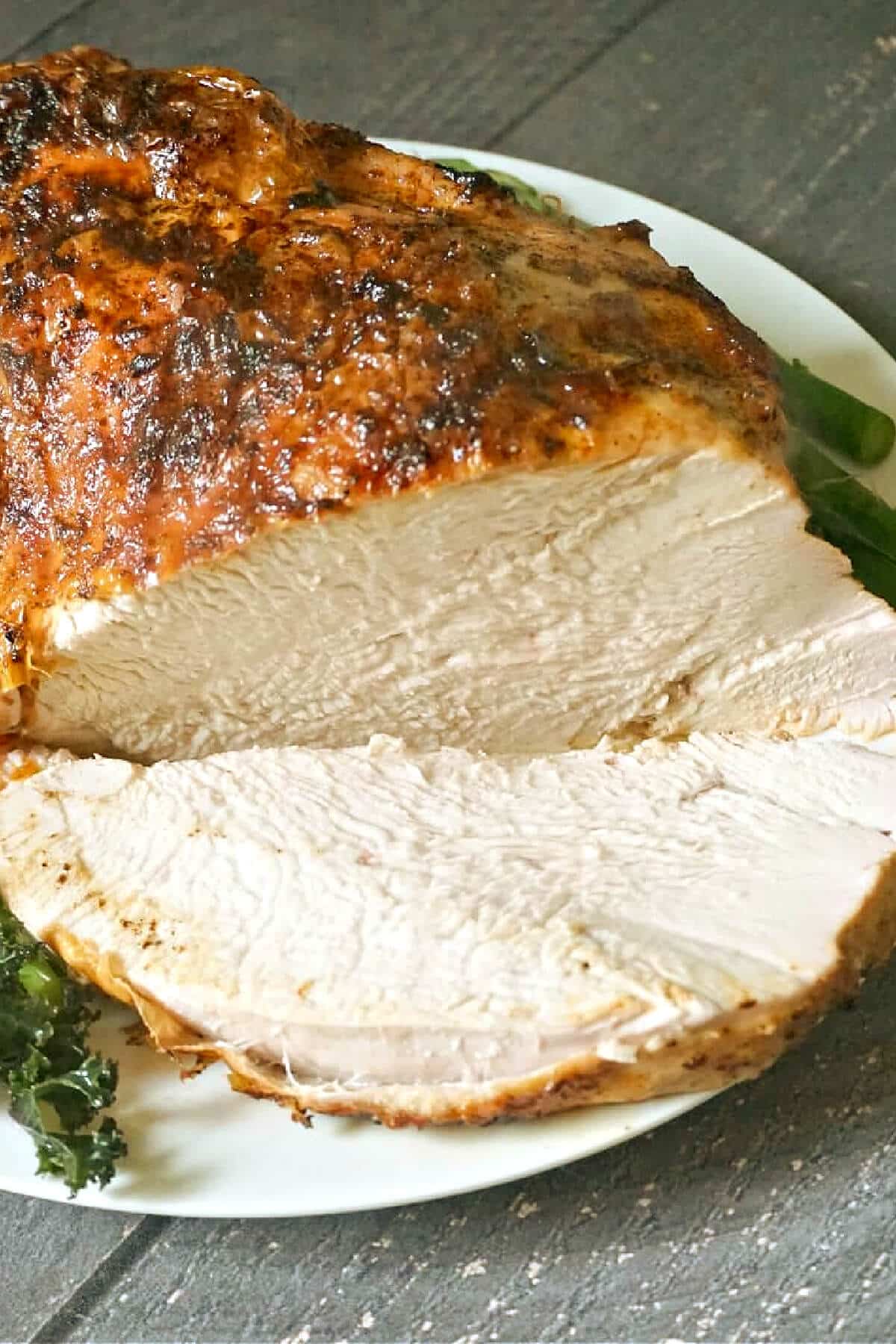 A sliced cooked turkey crown.