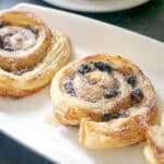 3 mince pie pinwheels on a white plate