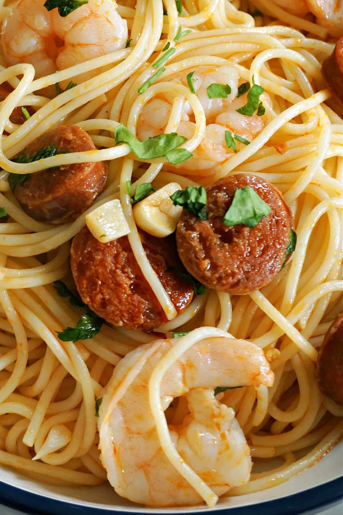 Close-up shoot of pasta with chorizo and king prawns.