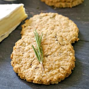 2 oat biscuits with a rosemary spring on top