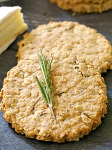 2 oat biscuits with a rosemary spring on top