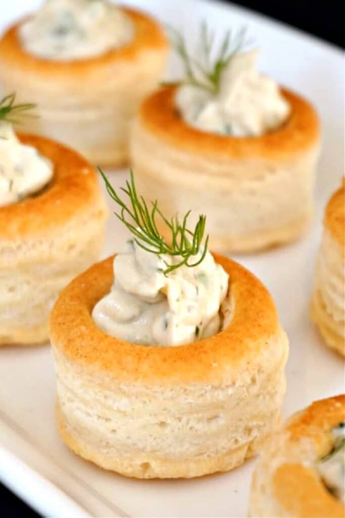 Smoked salmon pate canapes on a white plate