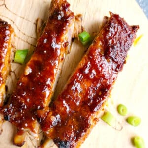 Overhead shoot of 2 pork ribs on a wooden board