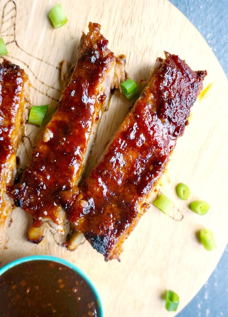 2 bbq ribs on a wooden board