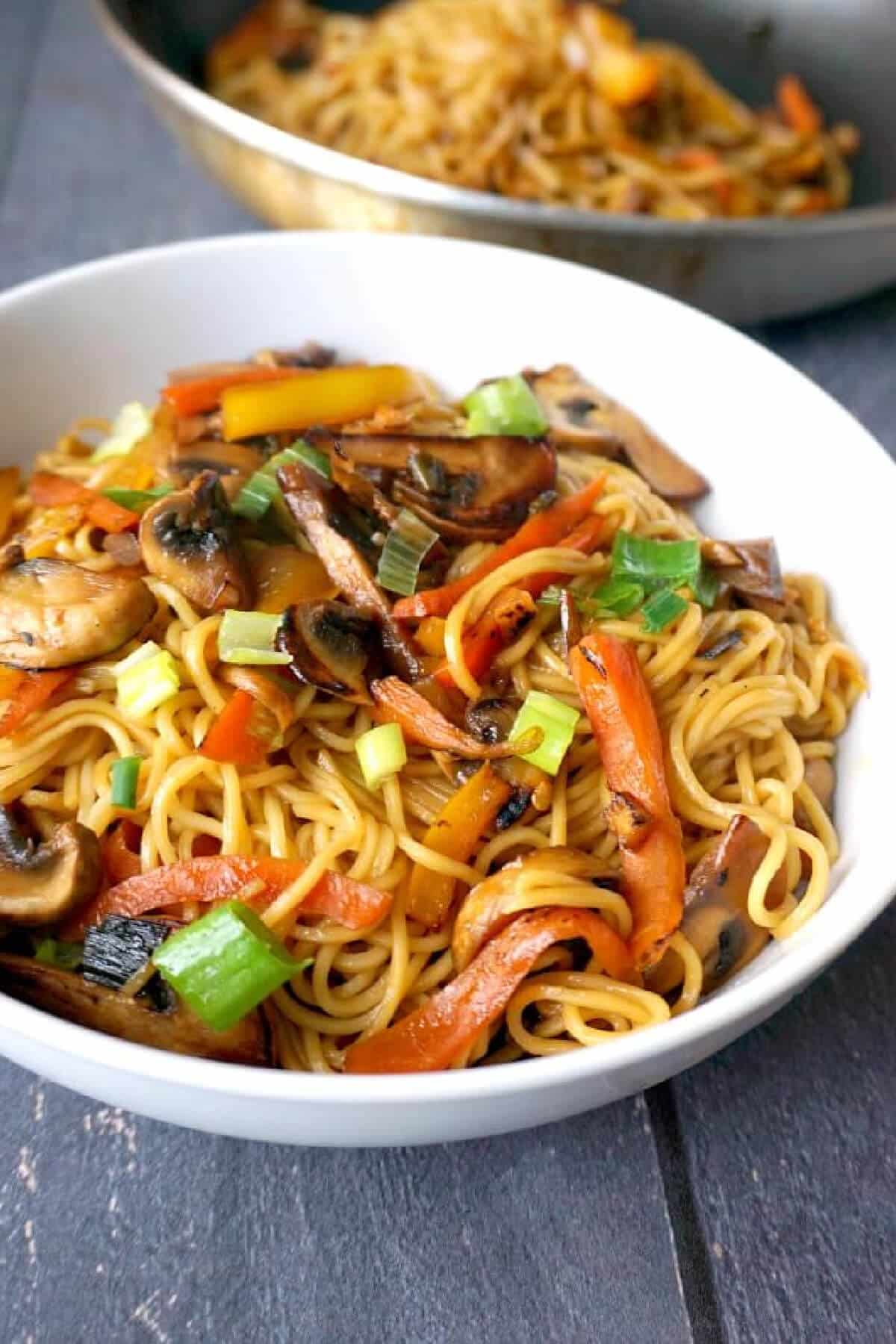 A white bowl with veggie noodles.