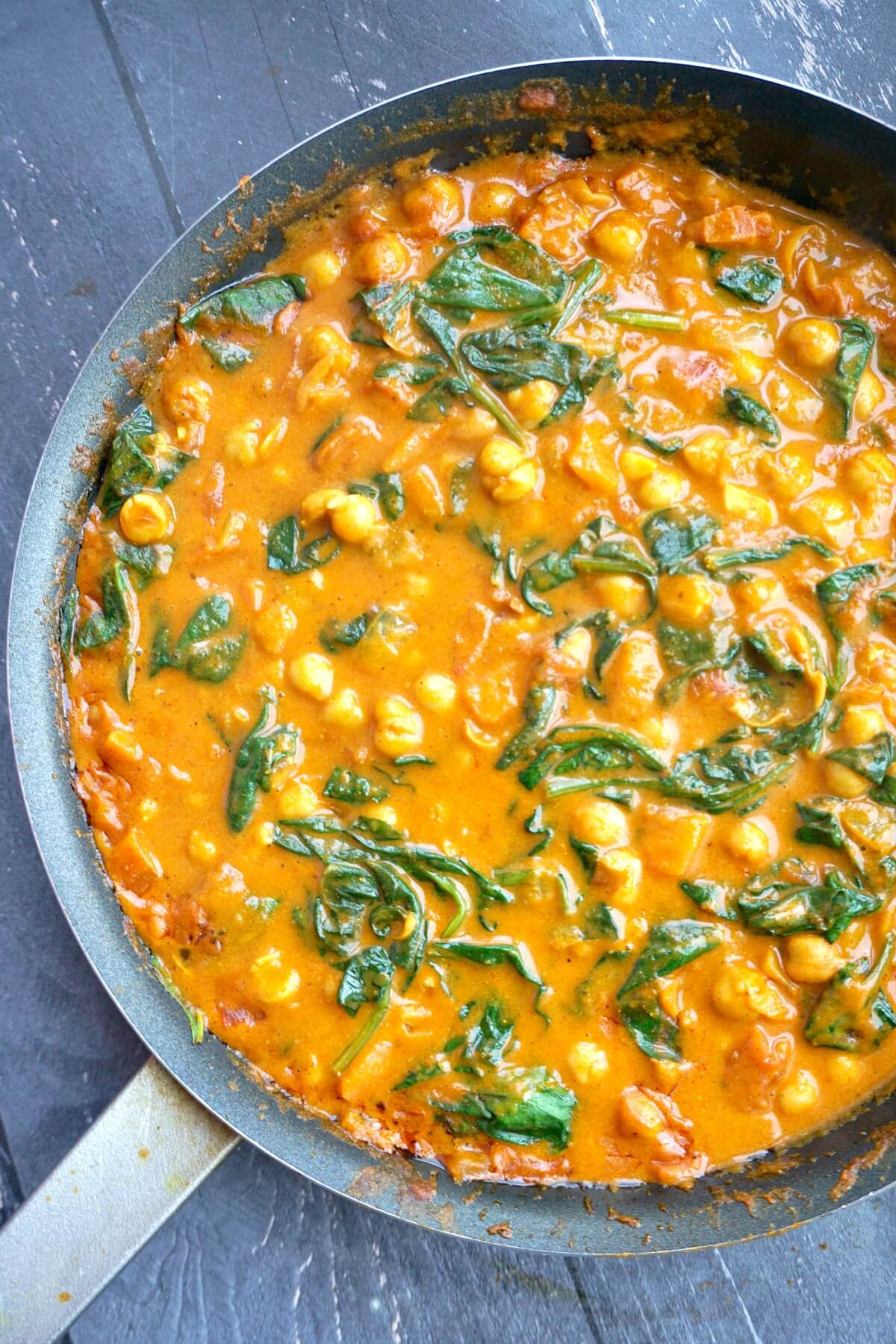A pot with coconut chickpea curry.