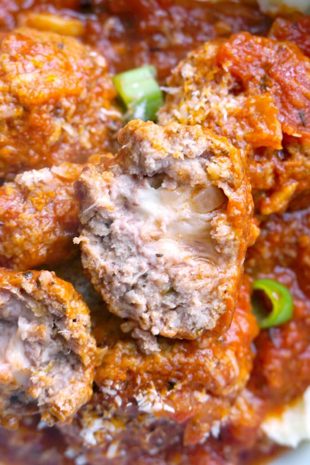 Close-up shoot of pork meatballs in tomato sauce.