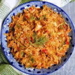 A blue plate with stewed cabbage