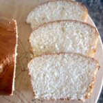 3 slices of brioche bread on a wooden board