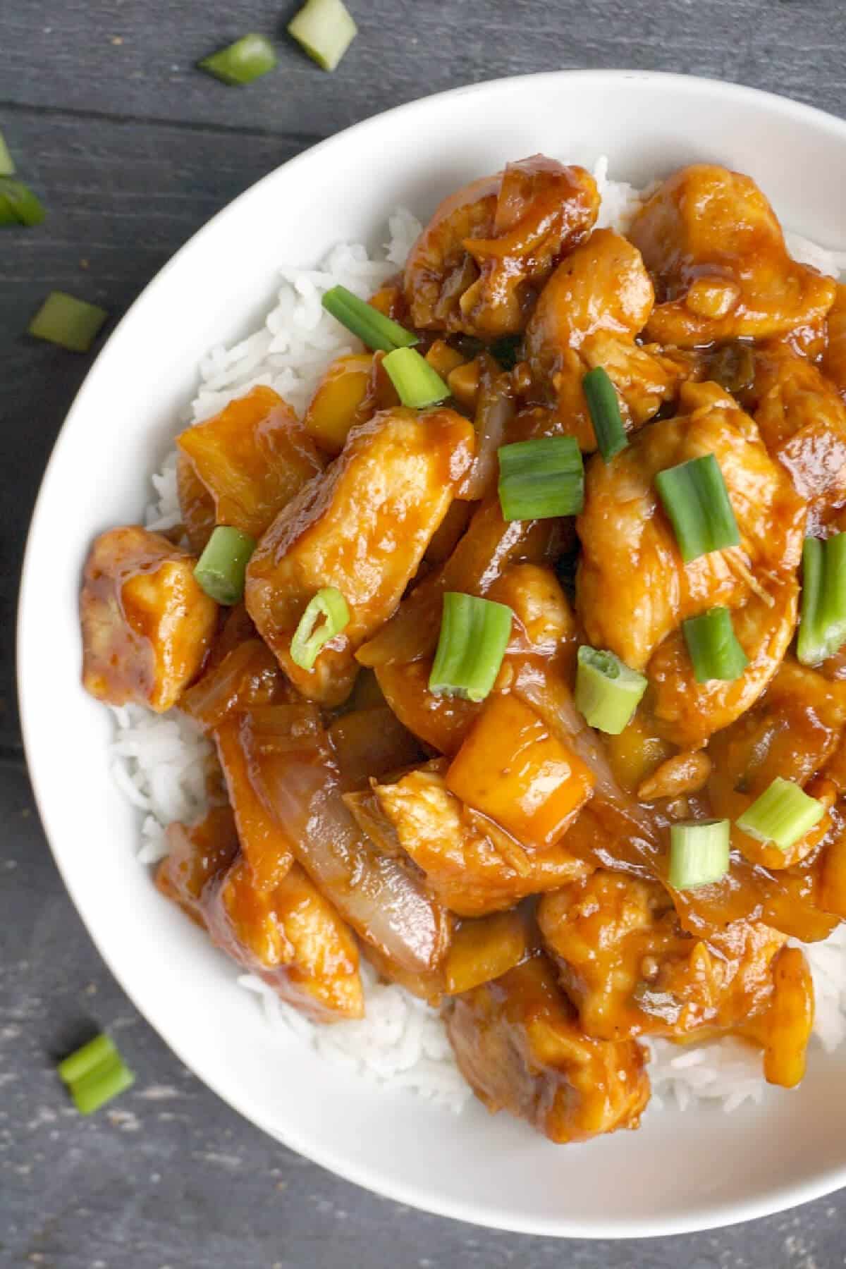 Sweet and sour chicken over a bed of rice.