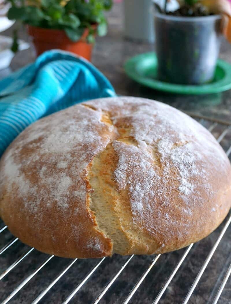 A potato bread on a cooling rack.