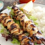Grilled Yogurt-Marinated Chicken Kebabs, a fantastic summer recipe that is light, healthy, and delicious. Serve it with rice and a nice crunchy salad, and you have a great lunch or dinner. It's so easy to make, but it's big on flavours. A must-try recipe for the BBQ season. The chicken kebabs are juicy and tender on the inside, and have a nice grilling colour on the outside. The yogurt keeps the chicken flavoured and absolutely yummy. #kebabs, #bbq, #yogurtmarinatedchickenkebabs, #chickenkebabs