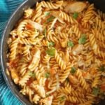 A pot of pasta with chicken