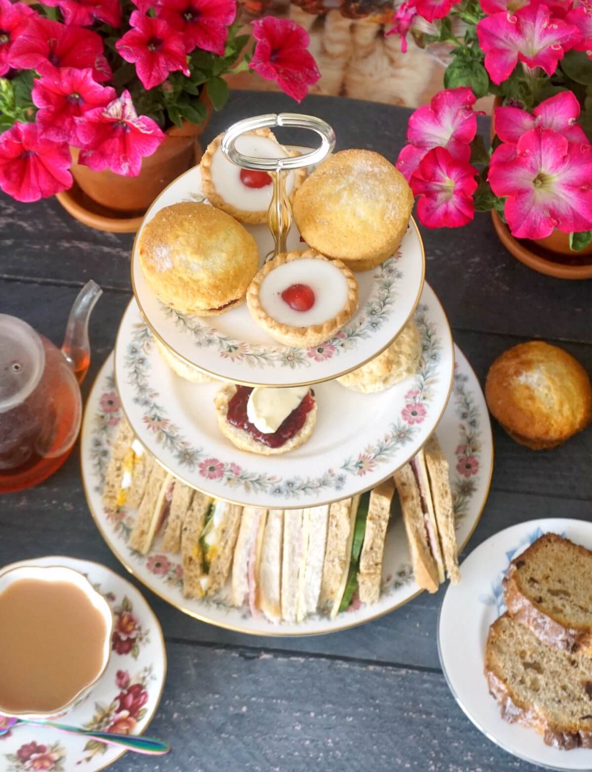 A cake stand with afternoon tea treats.