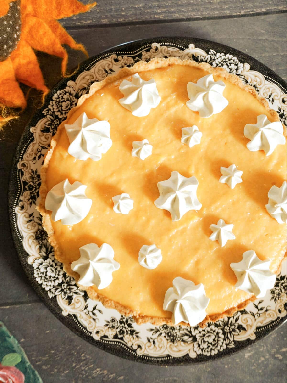 Overhead shot of a cantaloupe pie on a plate.