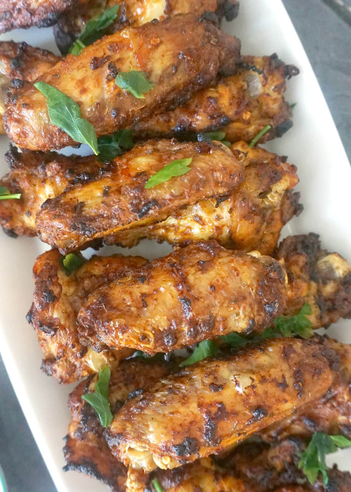 A white rectangle plate with chicken wings.