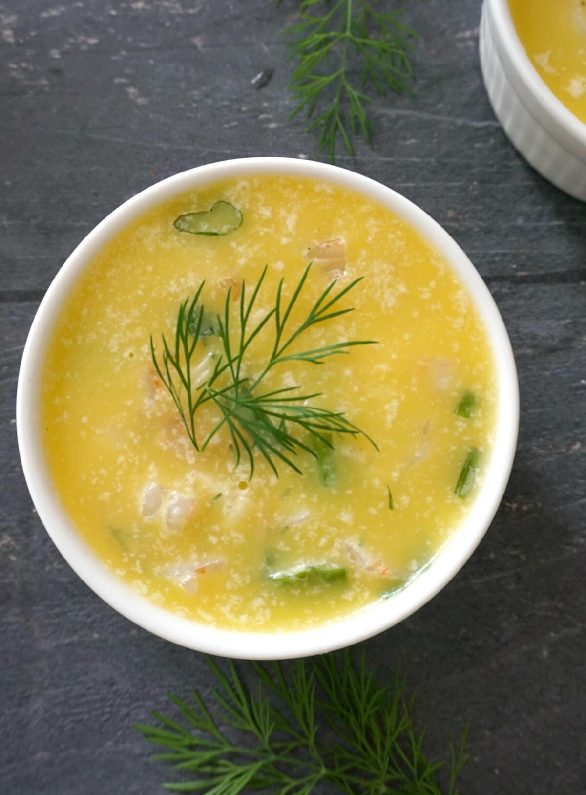 Overhead shoot of a ramekin with potted shrimp.