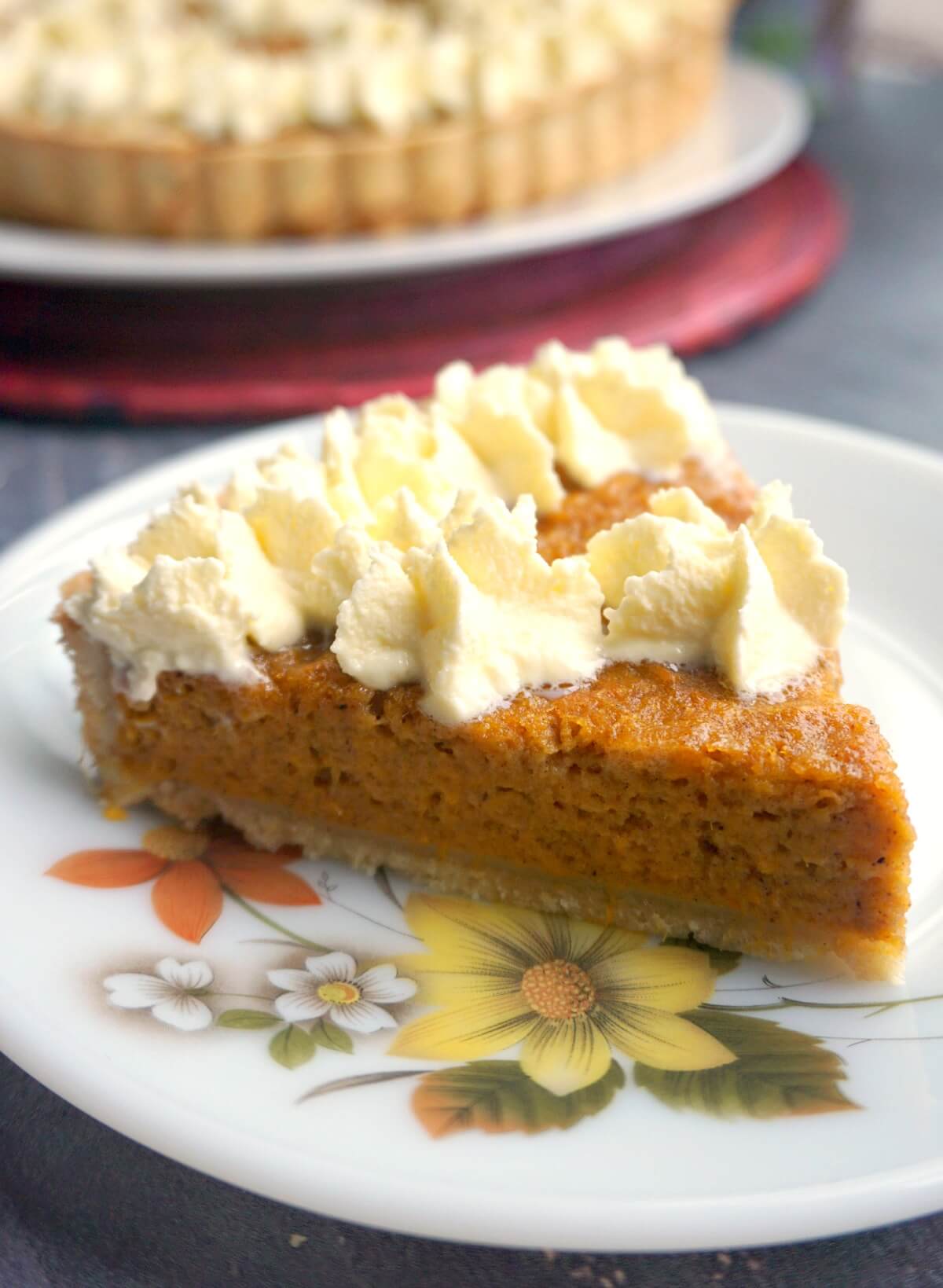 A slice of sweet potato pie on a plate.