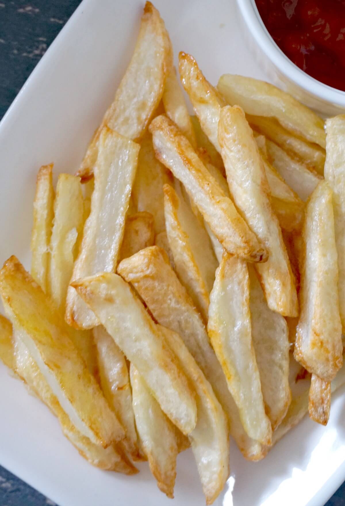 Close-up shoot of a white plate with fries