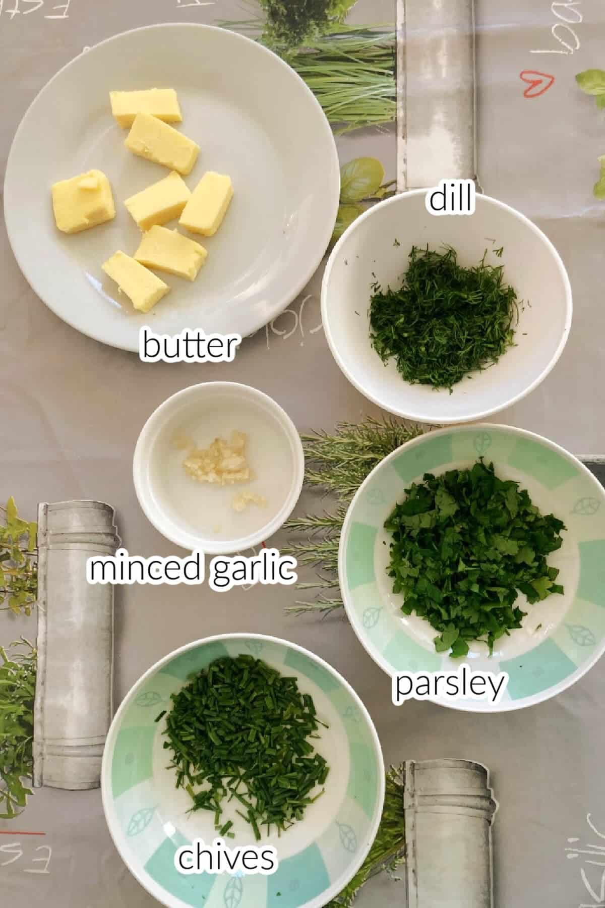 Ingredients needed to make garlic and herb butter.