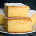 A stack of 2 slices of yogurt cornbread on a white plate