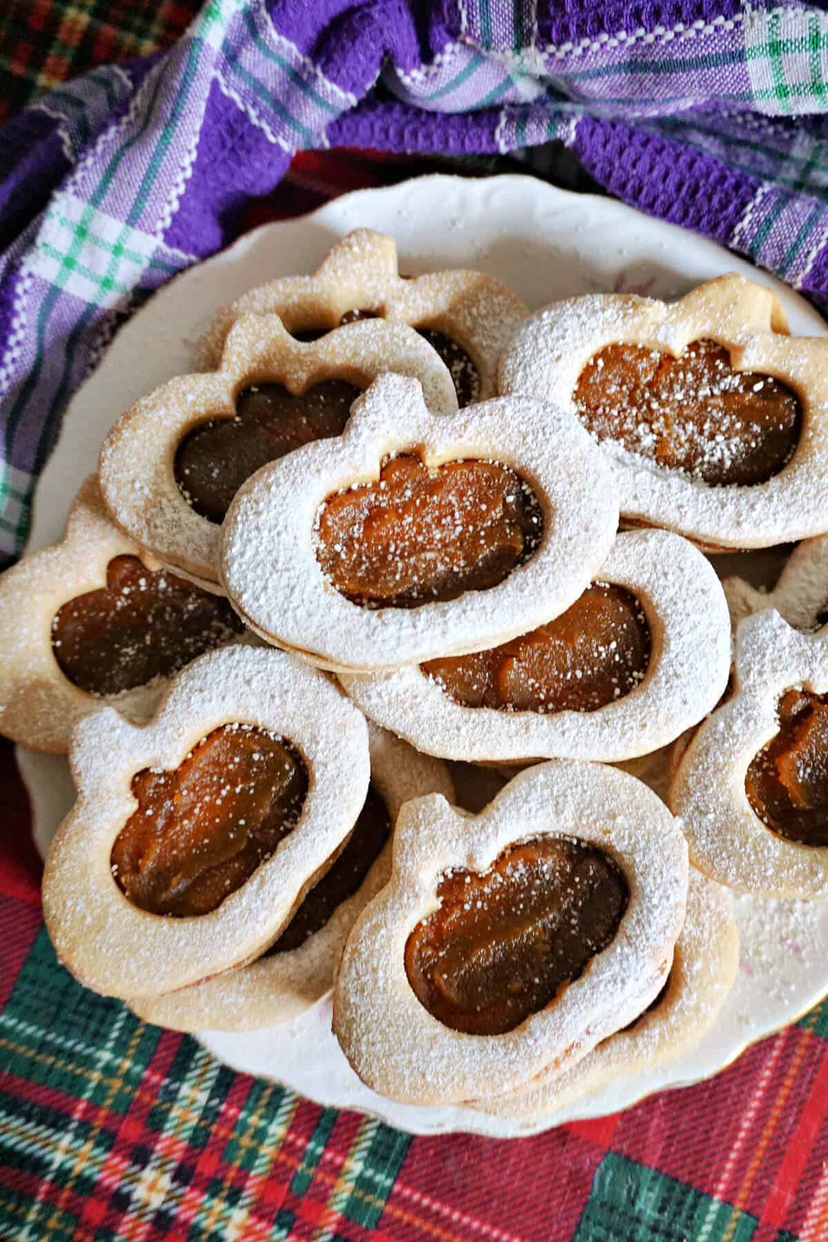 A plate with pumpkin cookies.
