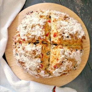 Overhead shoot of a wooden board with a bread on it