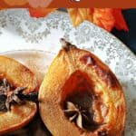 Baked quince halves on a plate.
