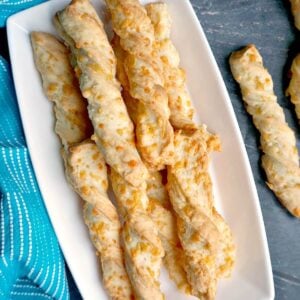 Overhead shoot of a white plate with cheese twists