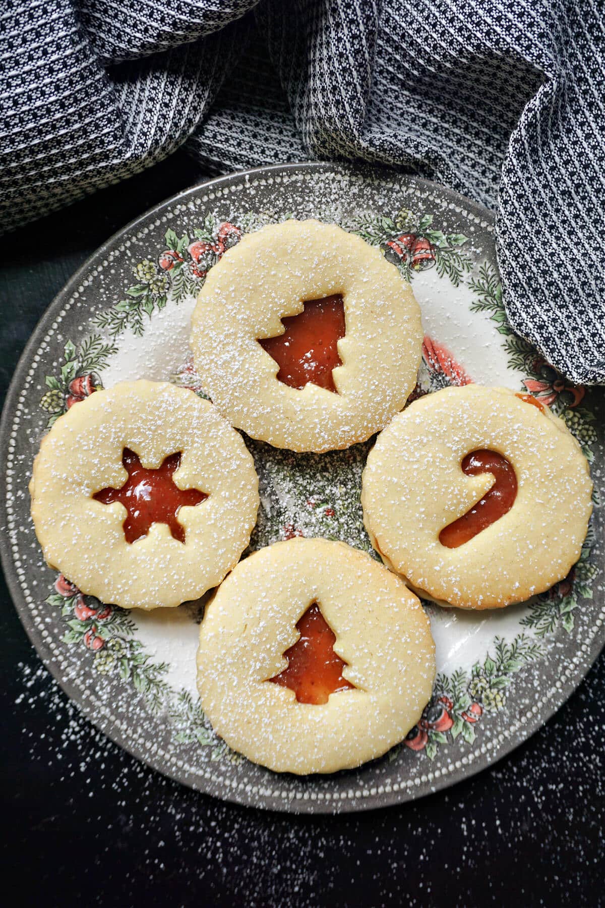 A plate with 4 linzer cookies.