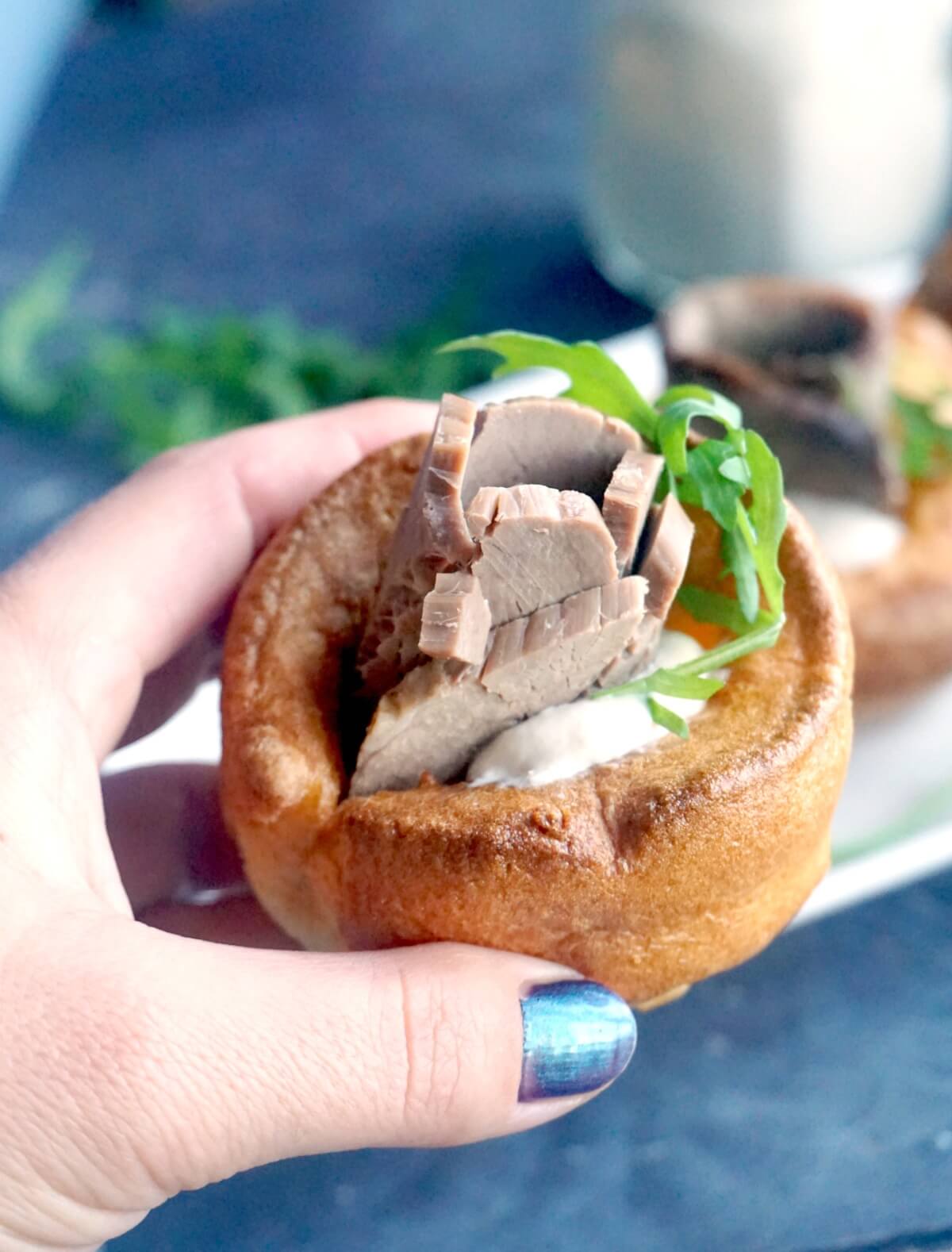 Hand holding a yorkshire pudding starter.