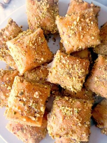 Overhead shoot of a white plate with baklava slices