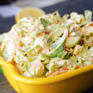 Close-up shoot of a yellow dish with brussel sprout slaw