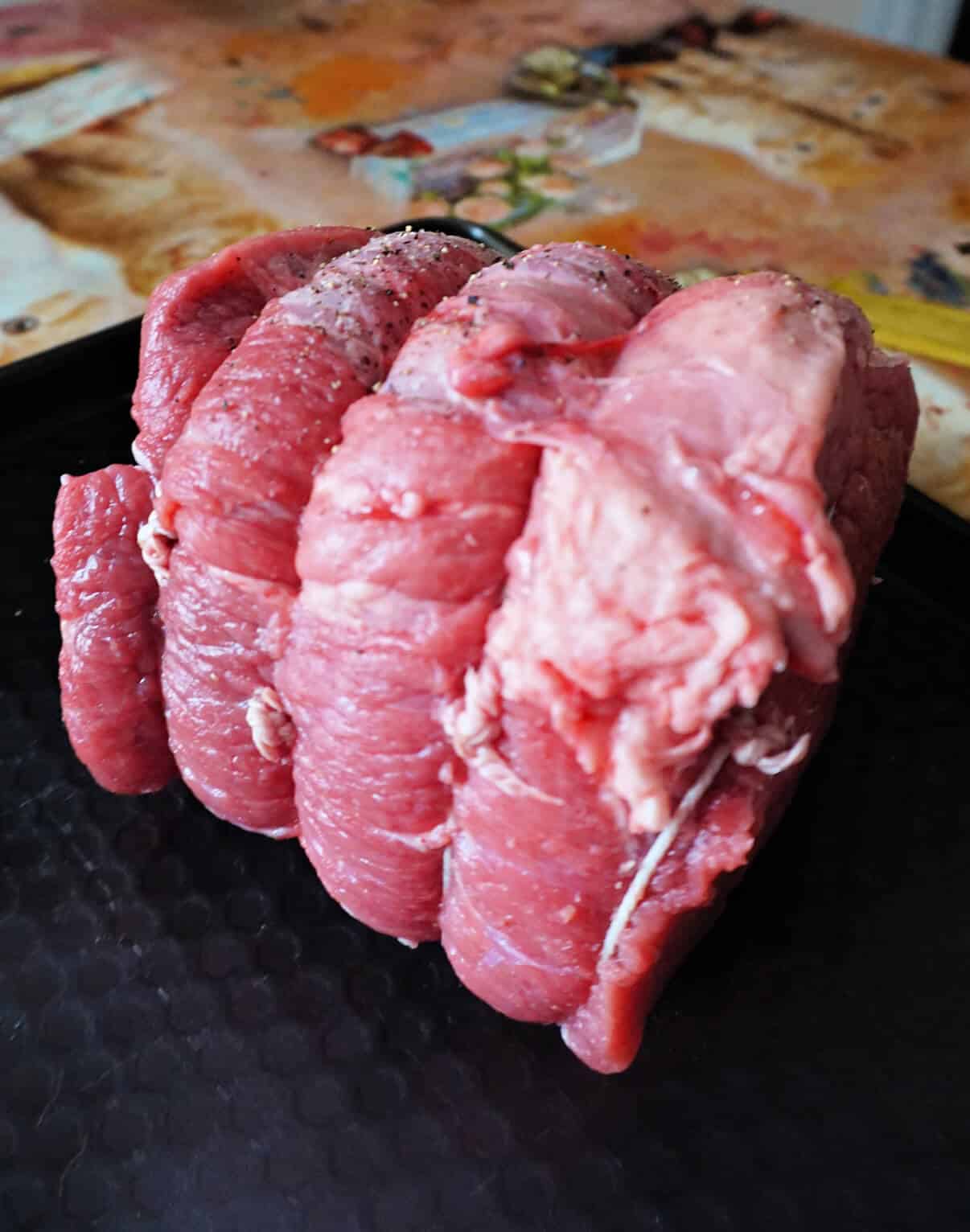 An uncooked joint of beef.