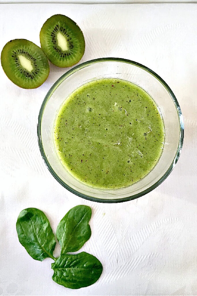 Overhead shoot of a glass of kiwi smoothie