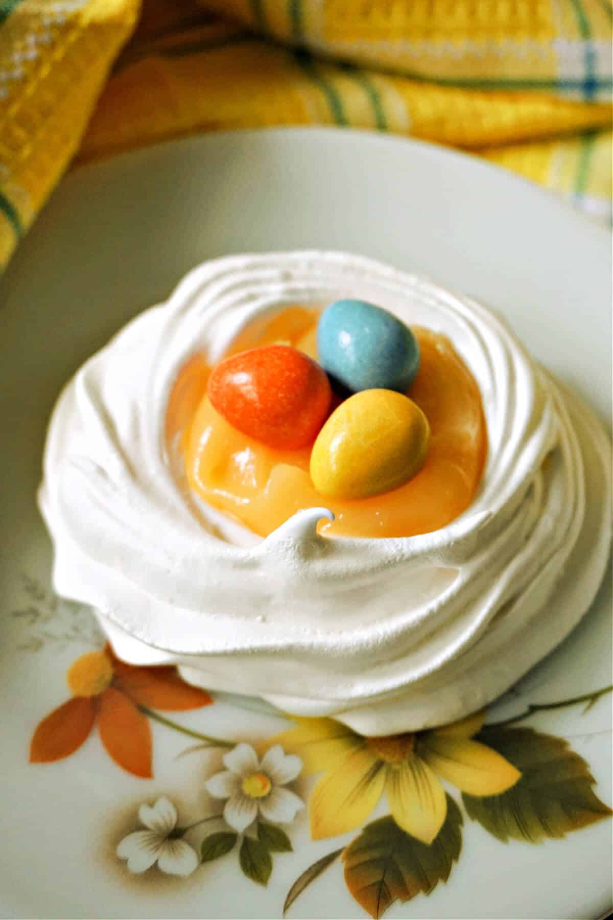 A meringue nest filled with lemon curd and mini eggs.