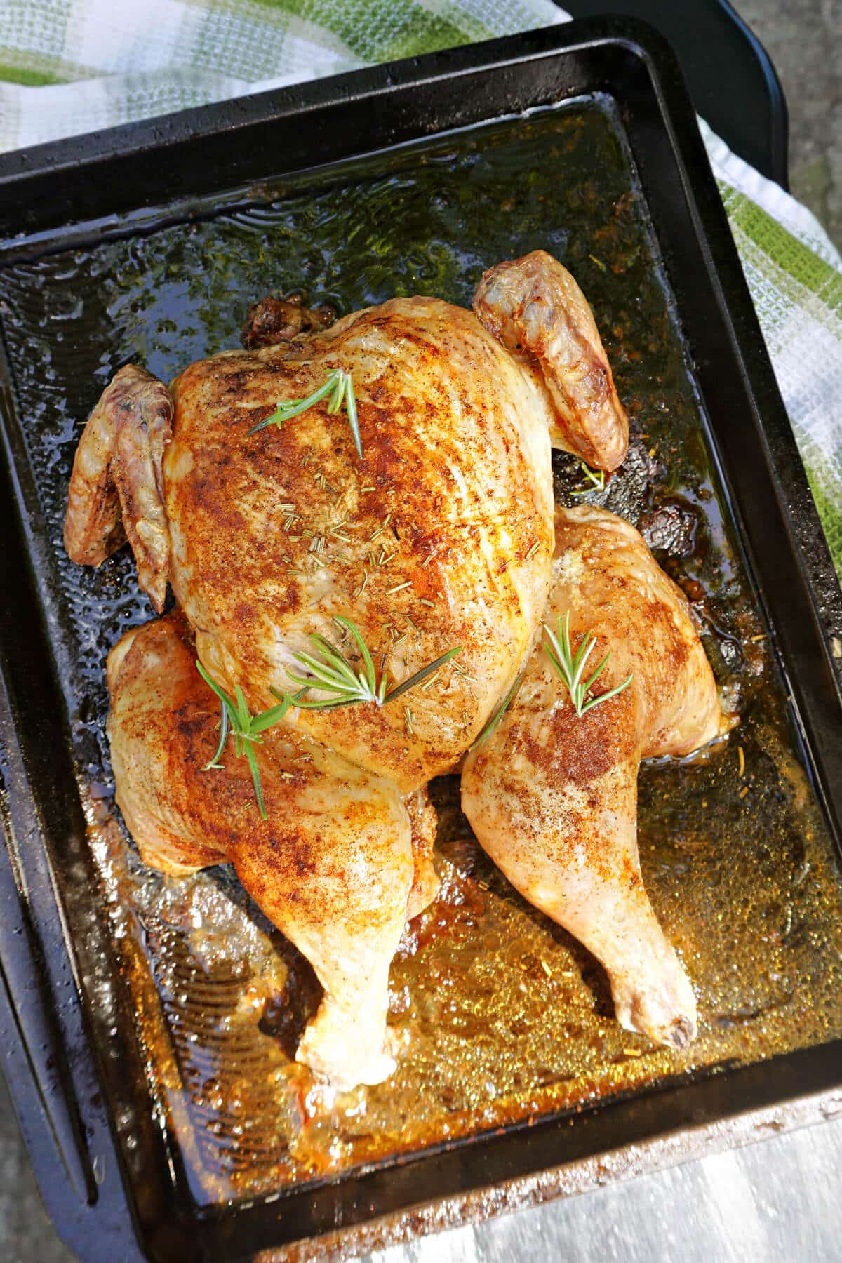 A tray with a spatchcock chicken.